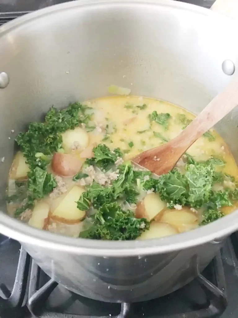 pot of soup with kale and potatoes.