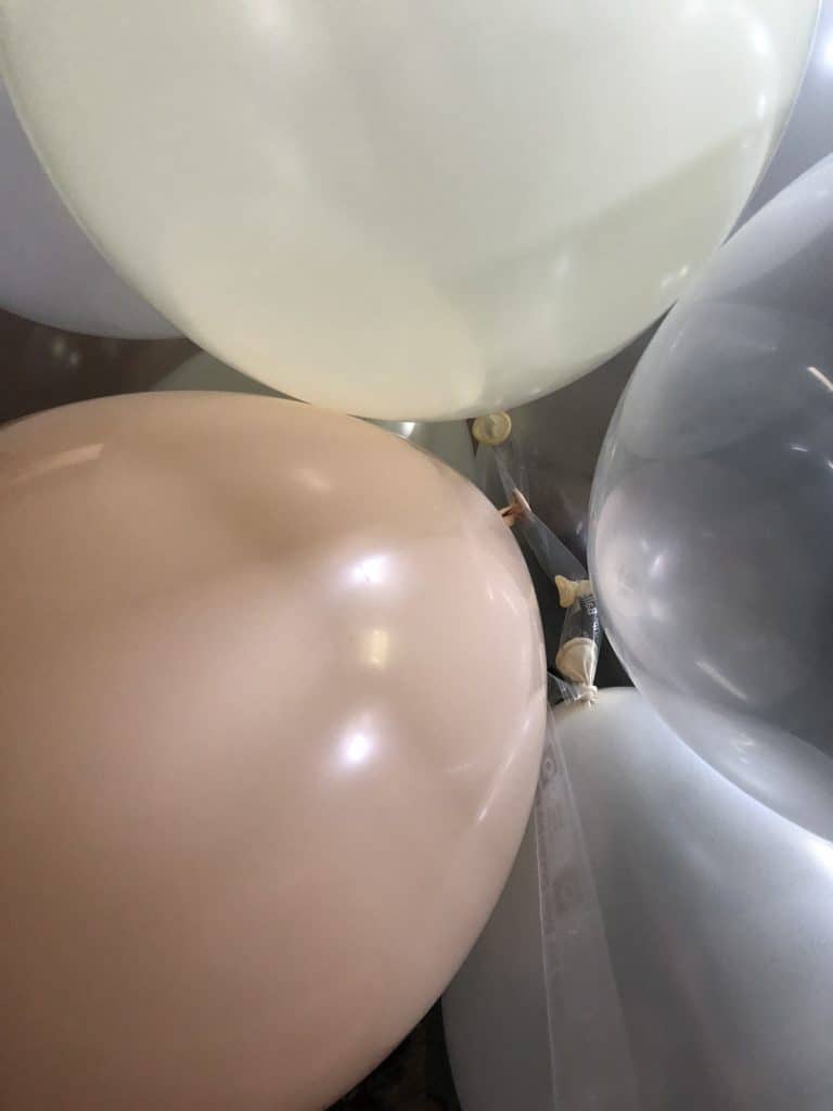 Attaching all the balloons together.