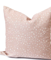 Pink pillow with white dots.