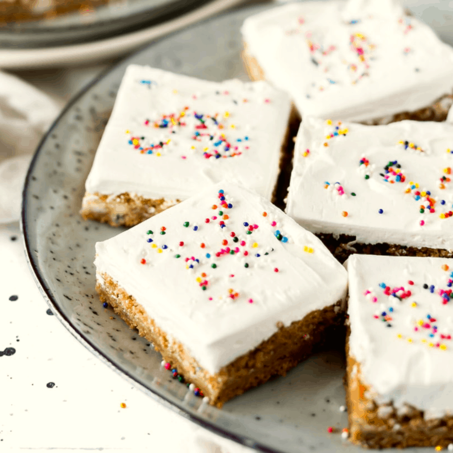 pumpkin bars with white frosting and sprinkles 