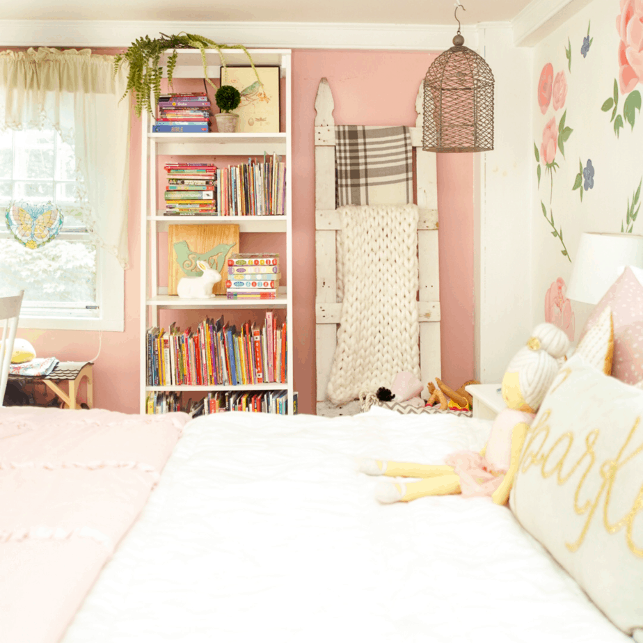 white bookshelf with white bed and blanket ladder