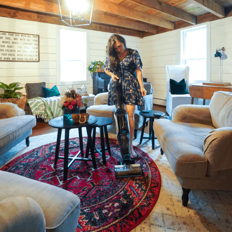 woman vacuuming a living room