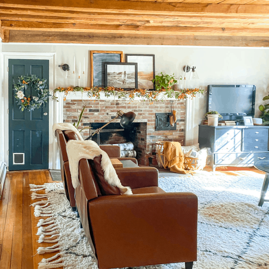 family room with brick fireplace and garland on the mantel
