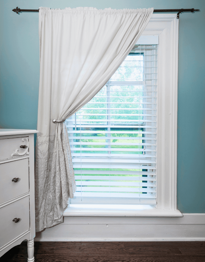 white windows with white blinds and curtains 